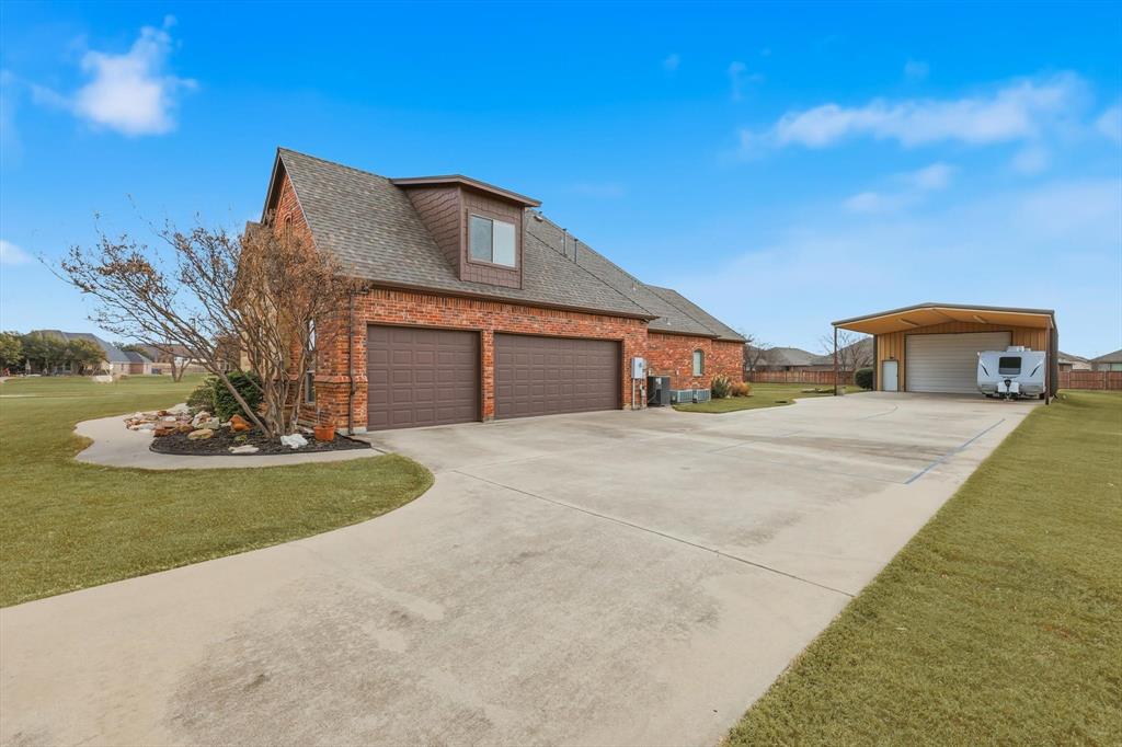 209 Lonesome Prairie Trail Haslet, TX 76052 - Photo 4 of 40 a front view of a house with garden
