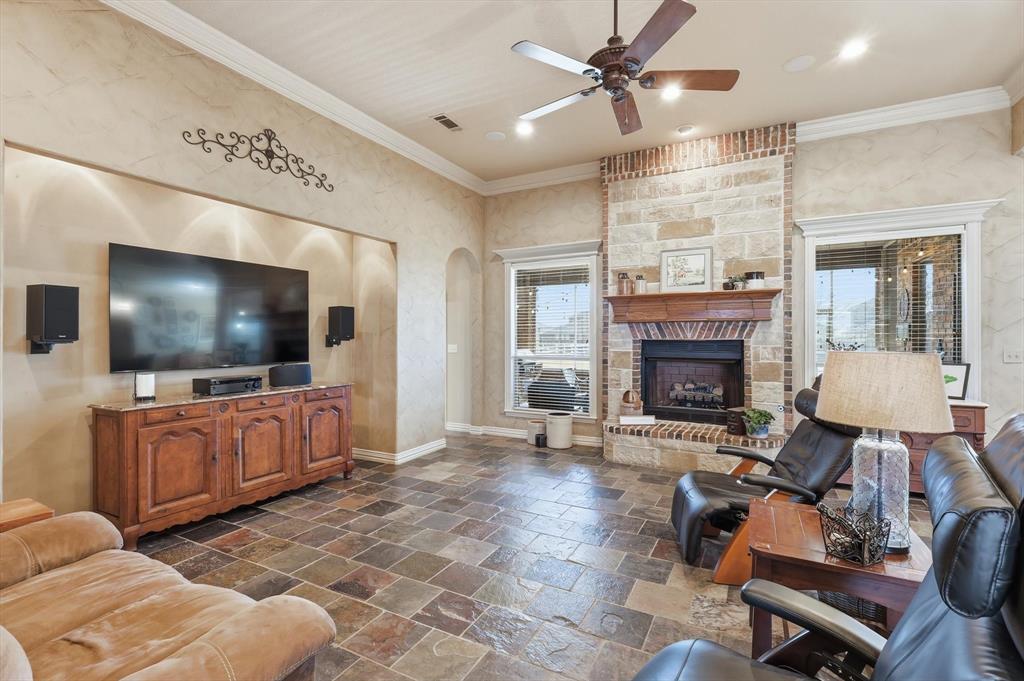 209 Lonesome Prairie Trail Haslet, TX 76052 - Photo 7 of 40 a living room with furniture and a flat screen tv
