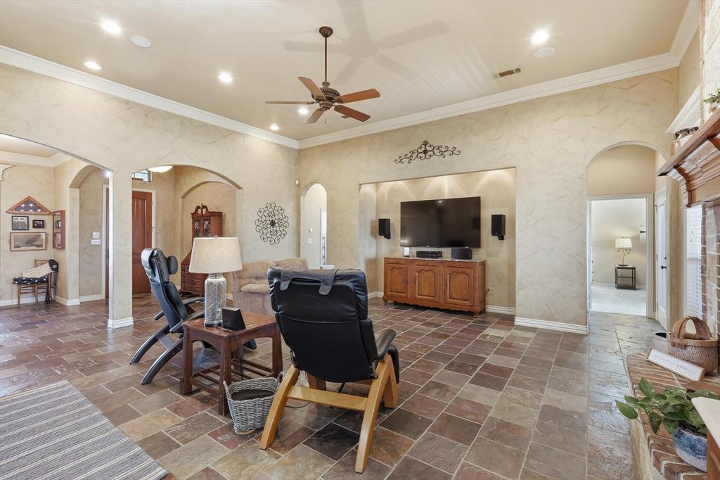 209 Lonesome Prairie Trail Haslet, TX 76052 - Photo 8 of 40 a living room with furniture and a flat screen tv