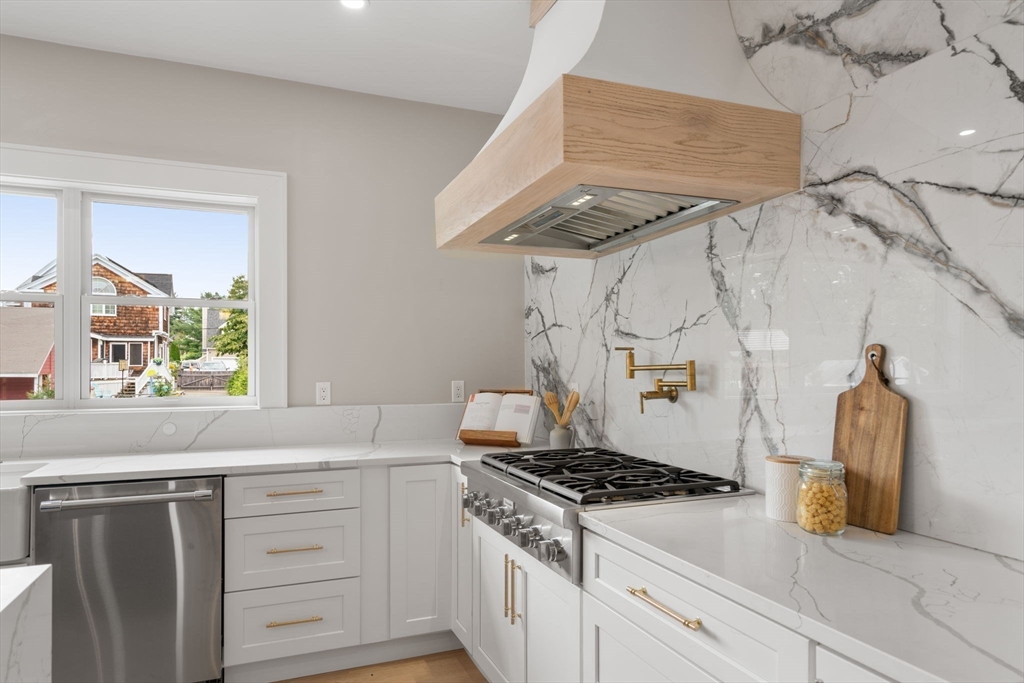 48 Cypress Road Milton, MA 02186 - Photo 15 of 39 a kitchen with a stove and a sink