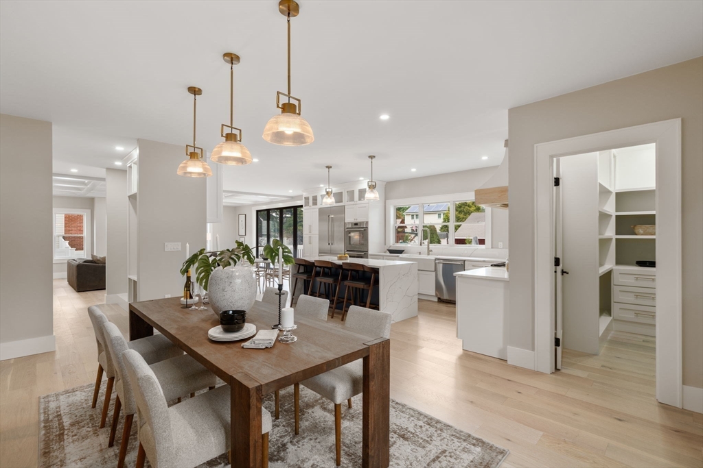 48 Cypress Road Milton, MA 02186 - Photo 17 of 39 a view of a dining room and livingroom with furniture