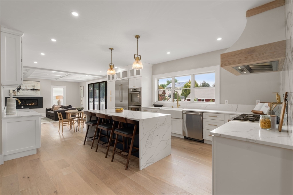 48 Cypress Road Milton, MA 02186 - Photo 18 of 39 a kitchen with lots of counter top space and dining table