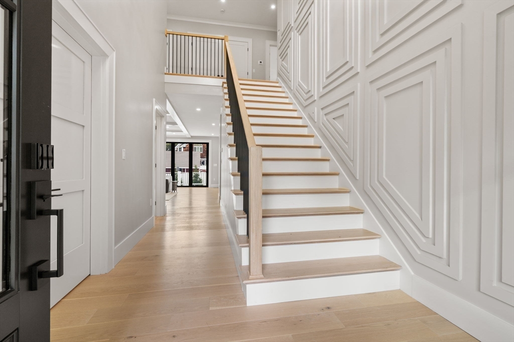 48 Cypress Road Milton, MA 02186 - Photo 2 of 39 a view of entryway and hall with wooden floor