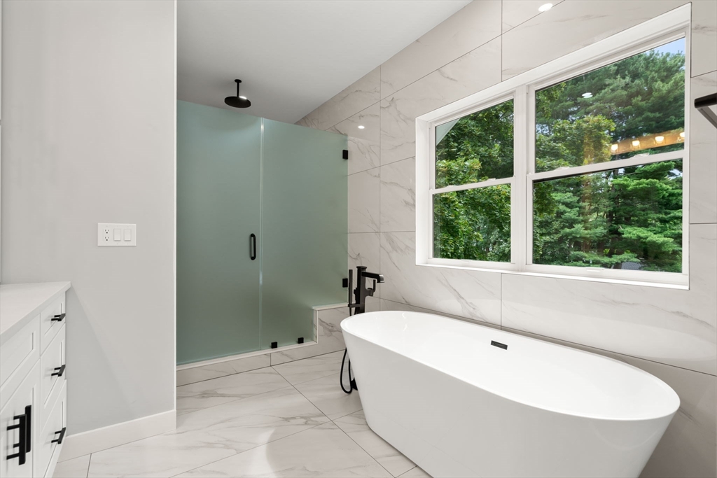 48 Cypress Road Milton, MA 02186 - Photo 21 of 39 a bathroom with a bathtub and shower