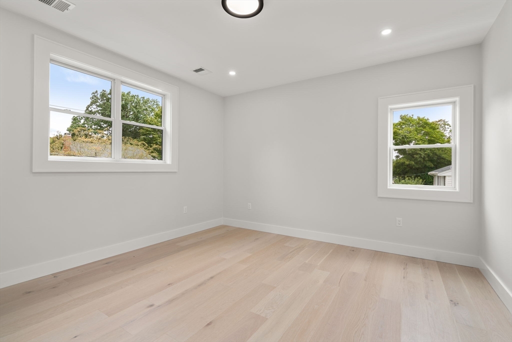 48 Cypress Road Milton, MA 02186 - Photo 24 of 39 an empty room with a window