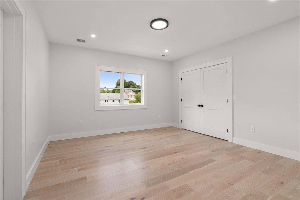 48 Cypress Road Milton, MA 02186 - Photo 28 of 39 an empty room with windows