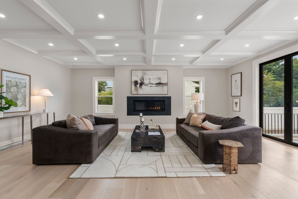 48 Cypress Road Milton, MA 02186 - Photo 3 of 39 a living room with furniture and a flat screen tv