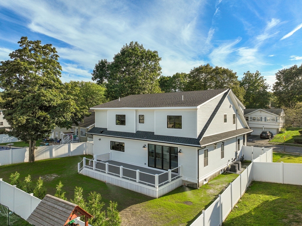 48 Cypress Road Milton, MA 02186 - Photo 36 of 39 aerial view of house with a big yard and large trees