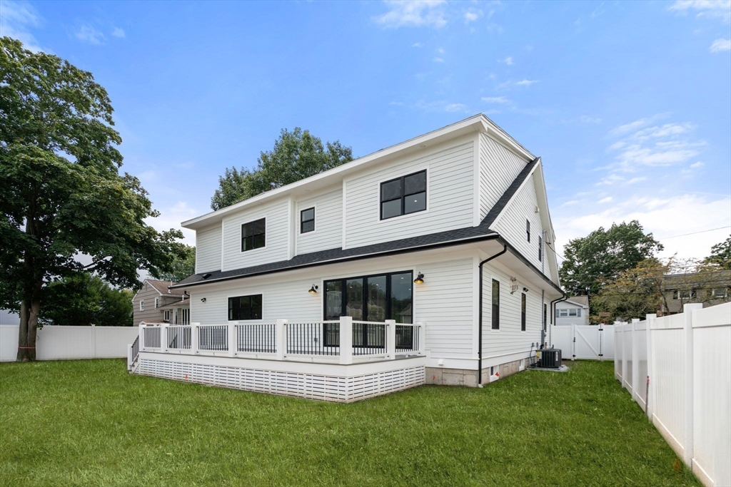 48 Cypress Road Milton, MA 02186 - Photo 37 of 39 a view of a house with a yard