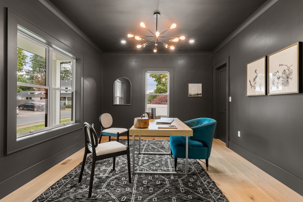48 Cypress Road Milton, MA 02186 - Photo 5 of 39 a dining room with furniture and wooden floor