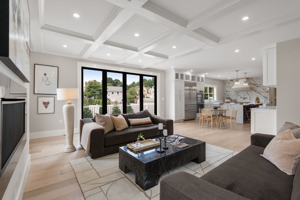 48 Cypress Road Milton, MA 02186 - Photo 10 of 39 a living room with fireplace furniture and a large window