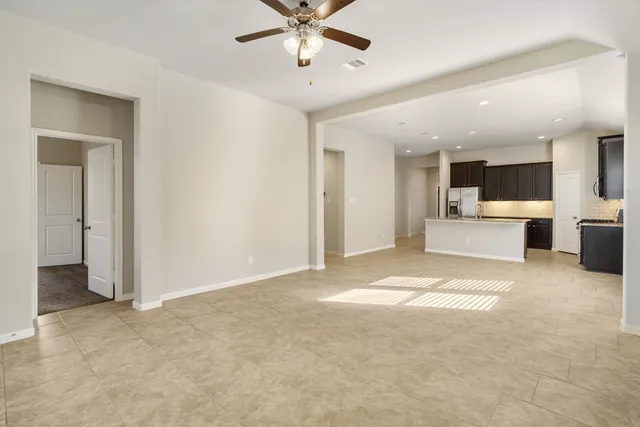 a view of a livingroom with a kitchen