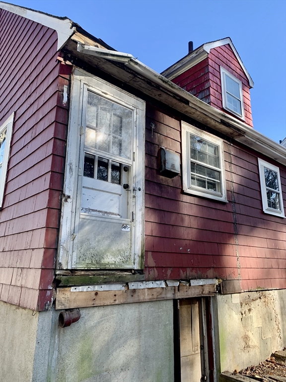 180 Dent Street Boston, MA 02132 - Photo 5 of 12 a front view of a house with a yard