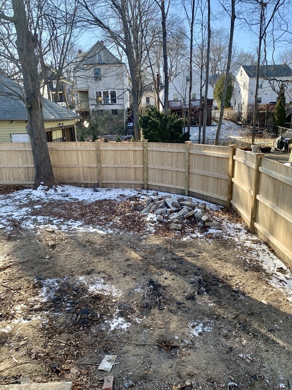 180 Dent Street Boston, MA 02132 - Photo 8 of 12 a view of a yard with a large tree