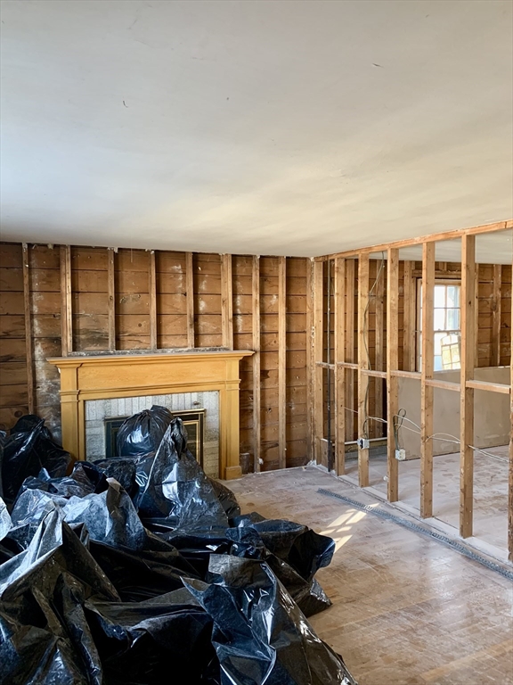 180 Dent Street Boston, MA 02132 - Photo 9 of 12 a room with furniture and a fireplace