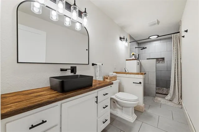 a view of a house with backyard patio and swimming pool