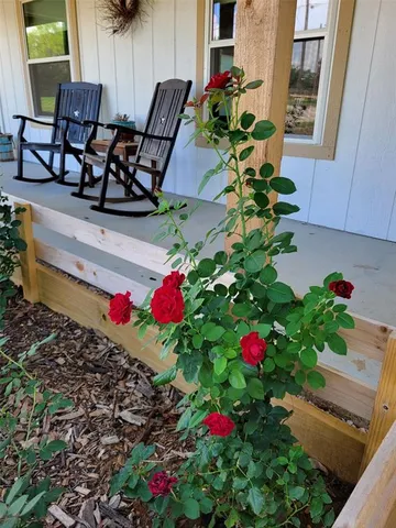 a kitchen with granite countertop a refrigerator and a sink