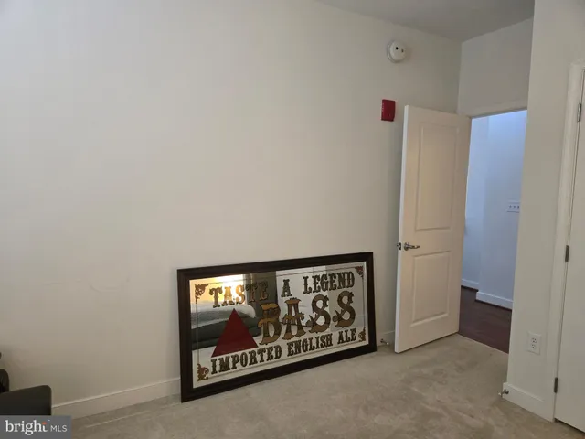 a living room with furniture and large windows