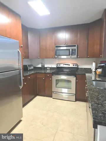 a view of empty room with furniture and wooden floor