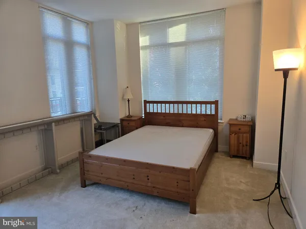 a view of a hallway with paintings on the wall