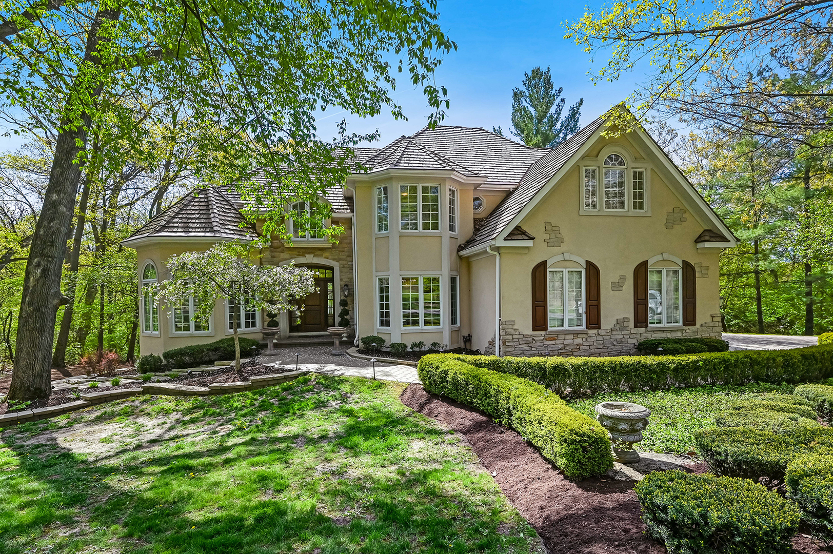 a front view of a house with a yard