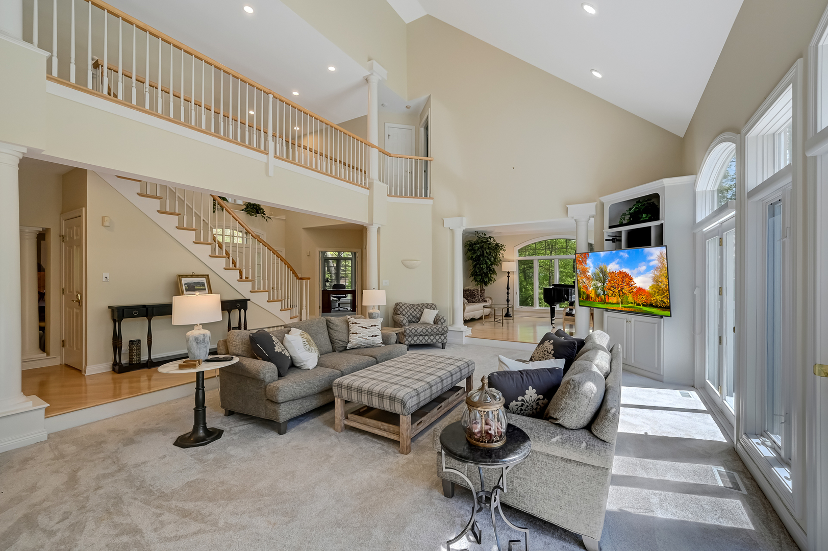 9301 Falling Waters Drive East Burr Ridge, IL 60527 - Photo 12 of 52 a living room with furniture gym equipment and a chandelier