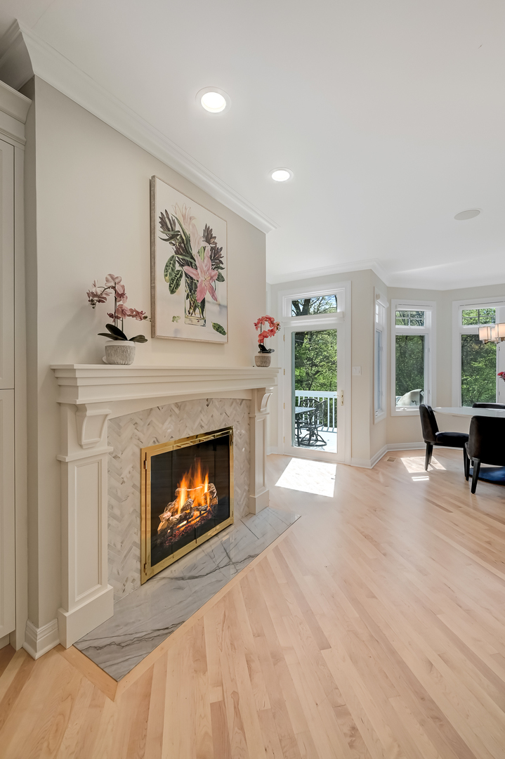 9301 Falling Waters Drive East Burr Ridge, IL 60527 - Photo 18 of 52 a living room with furniture and a fireplace