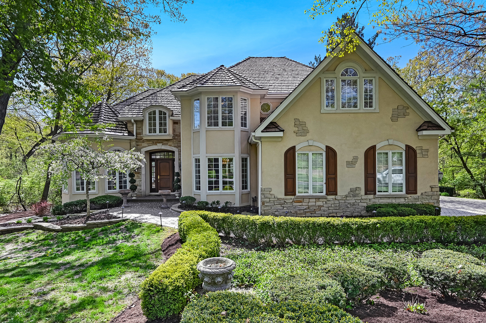 9301 Falling Waters Drive East Burr Ridge, IL 60527 - Photo 2 of 52 a front view of a house with a yard
