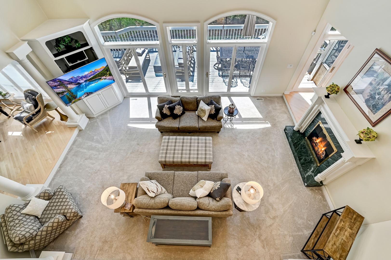 9301 Falling Waters Drive East Burr Ridge, IL 60527 - Photo 21 of 52 a living room with furniture a flat screen tv and a fireplace