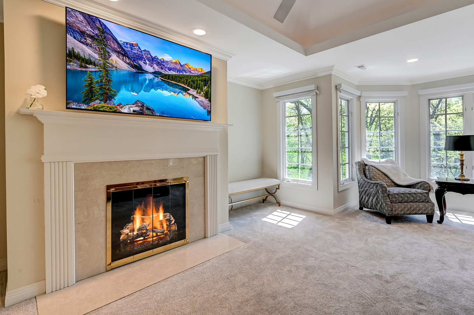9301 Falling Waters Drive East Burr Ridge, IL 60527 - Photo 23 of 52 a living room with furniture a fireplace and a large window