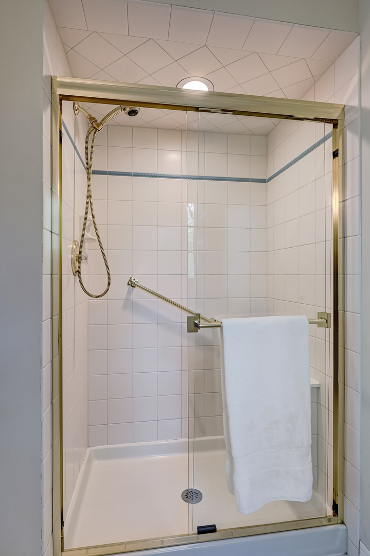 9301 Falling Waters Drive East Burr Ridge, IL 60527 - Photo 33 of 52 a bathroom with a glass shower door