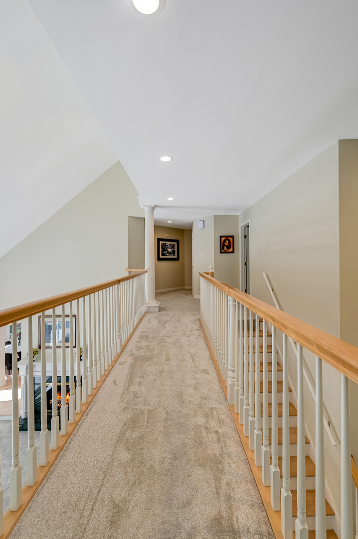 9301 Falling Waters Drive East Burr Ridge, IL 60527 - Photo 34 of 52 a view of a hallway with closet and stairs