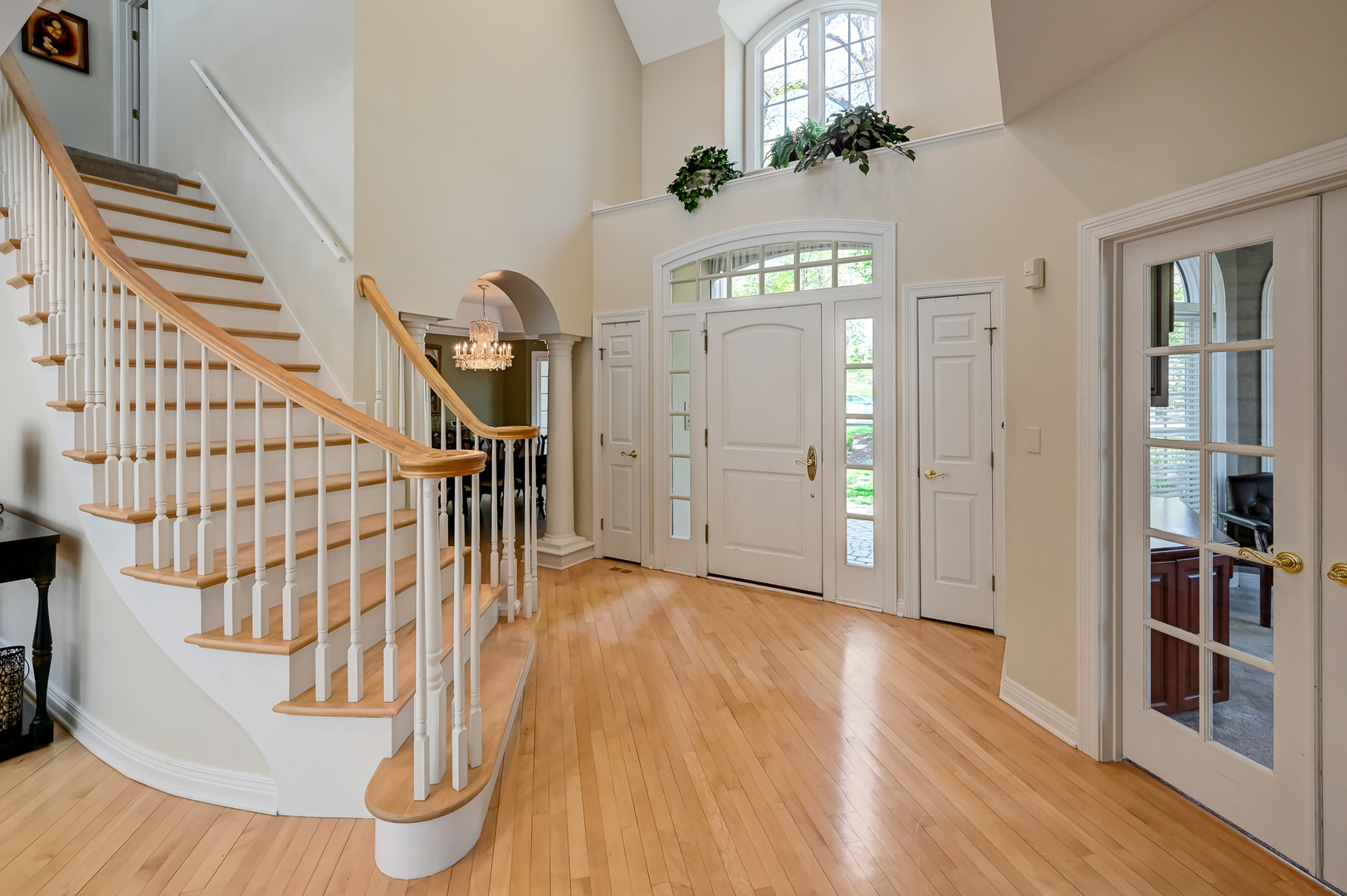 9301 Falling Waters Drive East Burr Ridge, IL 60527 - Photo 4 of 52 a view of entryway and hall with wooden floor