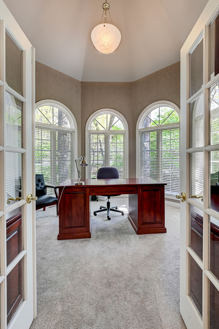 9301 Falling Waters Drive East Burr Ridge, IL 60527 - Photo 7 of 52 a living room with furniture and a large window