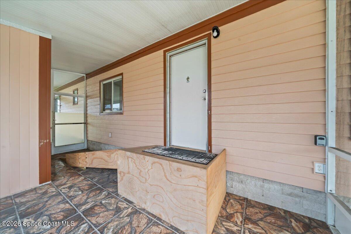 1740 Seagrape Street Northeast Palm Bay, FL 32905 - Photo 3 of 33 a backyard of a house