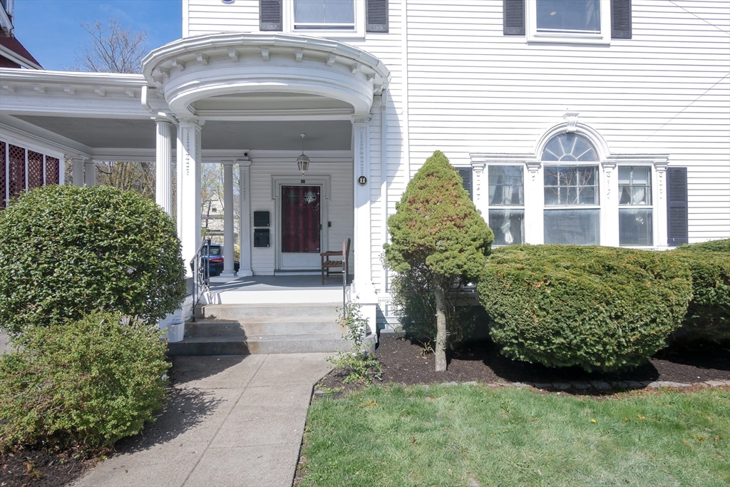11 Wayne Street Boston, MA 02121 - Photo 3 of 27 a front view of a house with garden