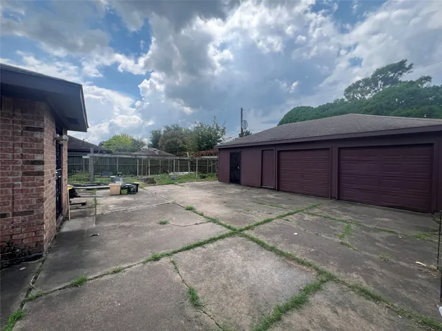 a view of backyard with seating space