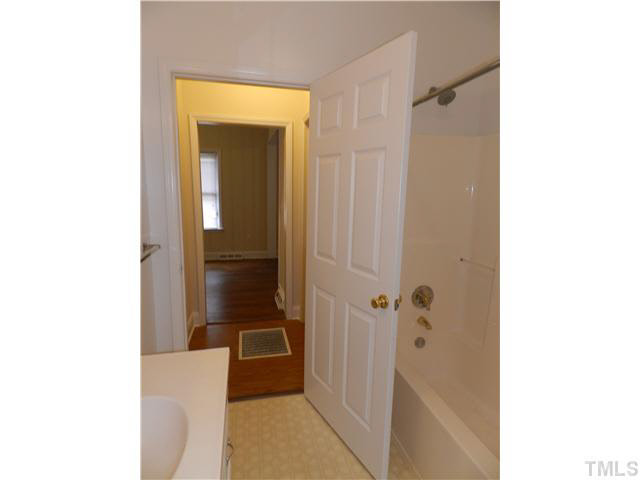 819 Ellington Street Raleigh, NC 27601 - Photo 8 of 19 a bathroom with a tub and shower