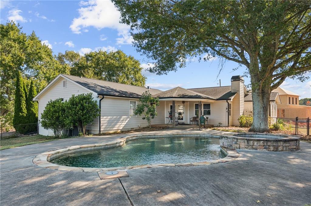 2740 Talley Lane Buford, GA 30519 - Photo 10 of 16 a front view of a house with a yard