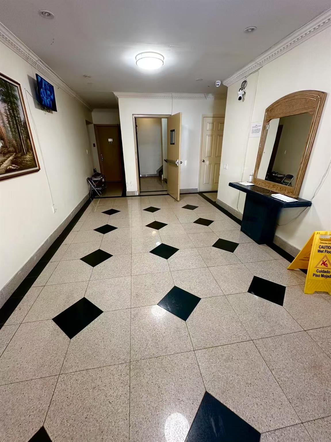 104-48 37th Drive, Unit 2 Queens, NY 11368 - Photo 4 of 15 Corridor with crown molding