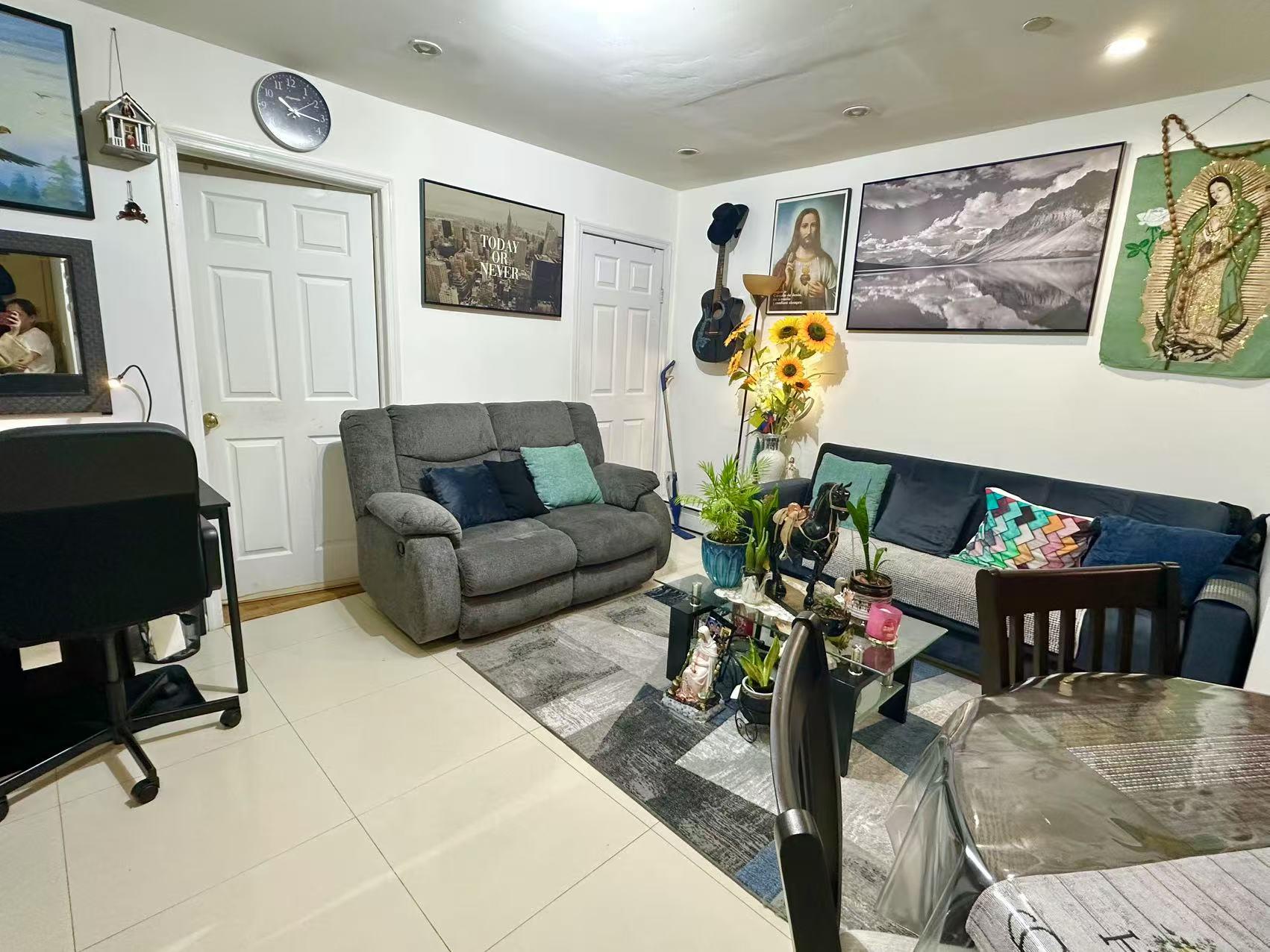 104-48 37th Drive, Unit 2 Queens, NY 11368 - Photo 6 of 15 View of tiled living room
