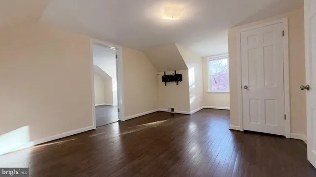 an empty room with wooden floor
