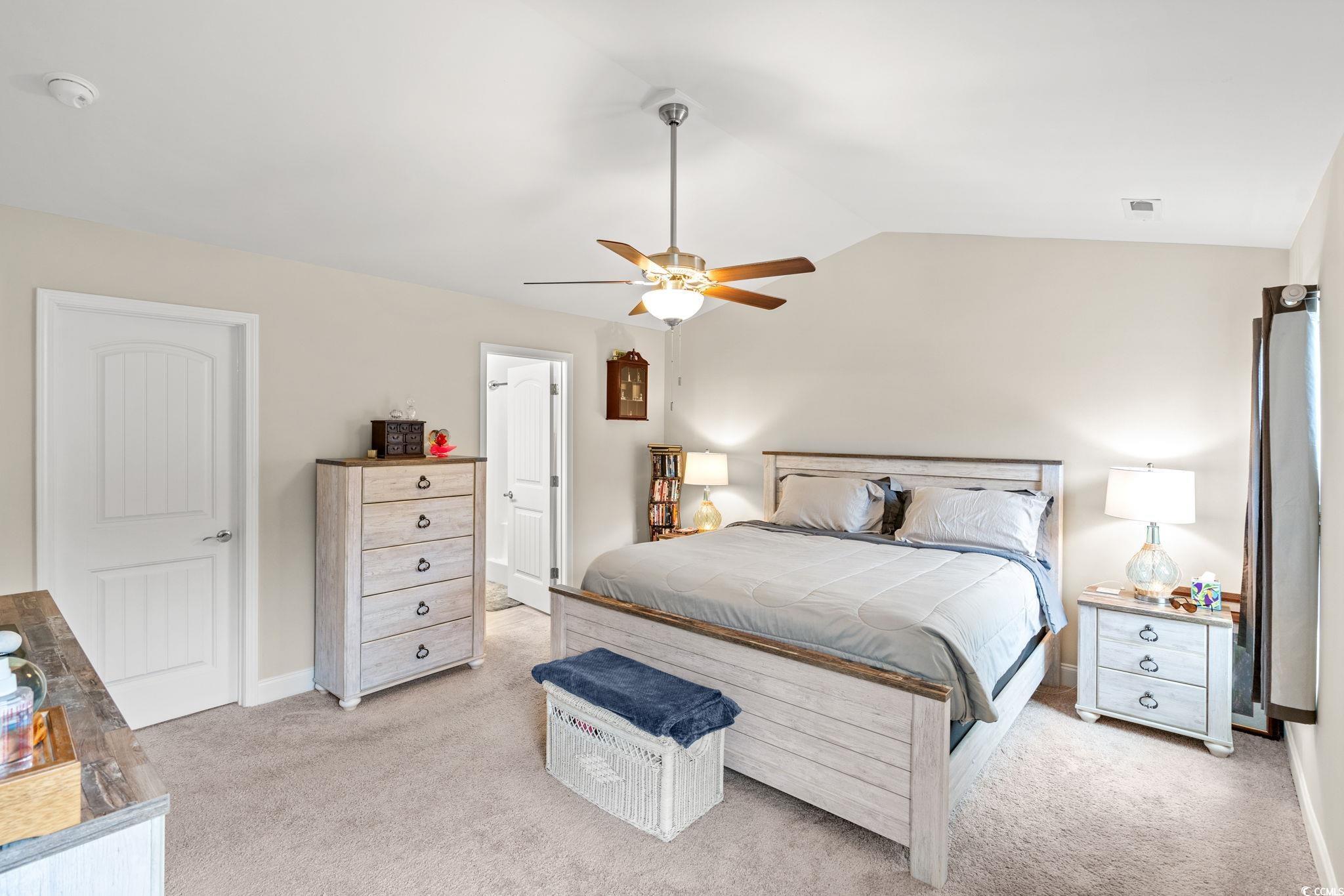 1209 Wehler Court Conway, SC 29526 - Photo 12 of 32 Bedroom with vaulted ceiling, light colored carpet, and a ceiling fan