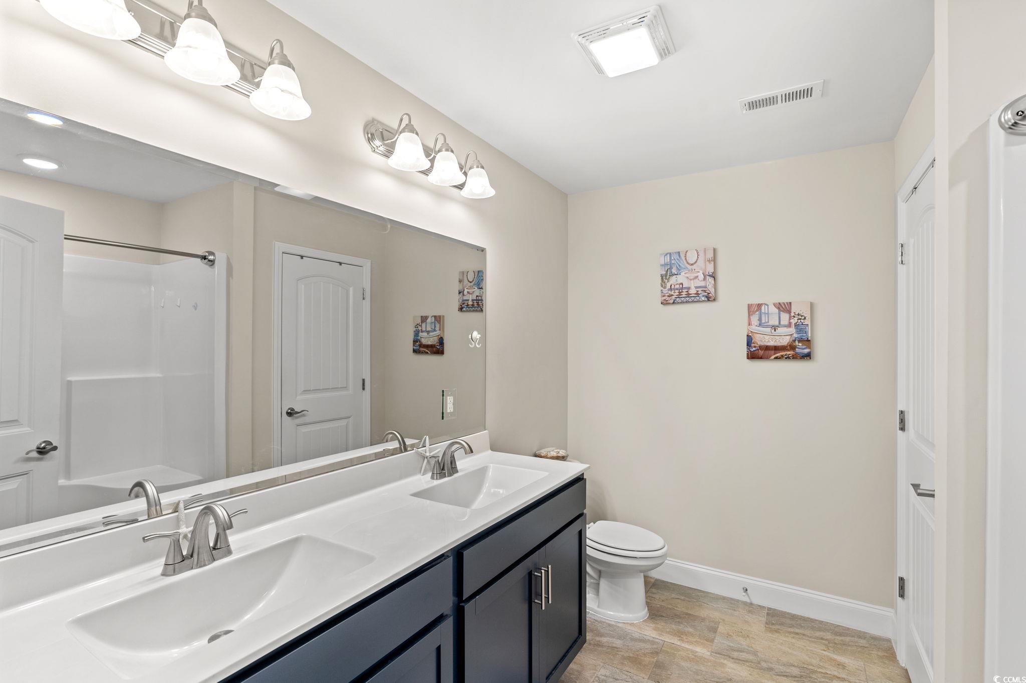 1209 Wehler Court Conway, SC 29526 - Photo 14 of 32 Bathroom featuring double vanity and toilet