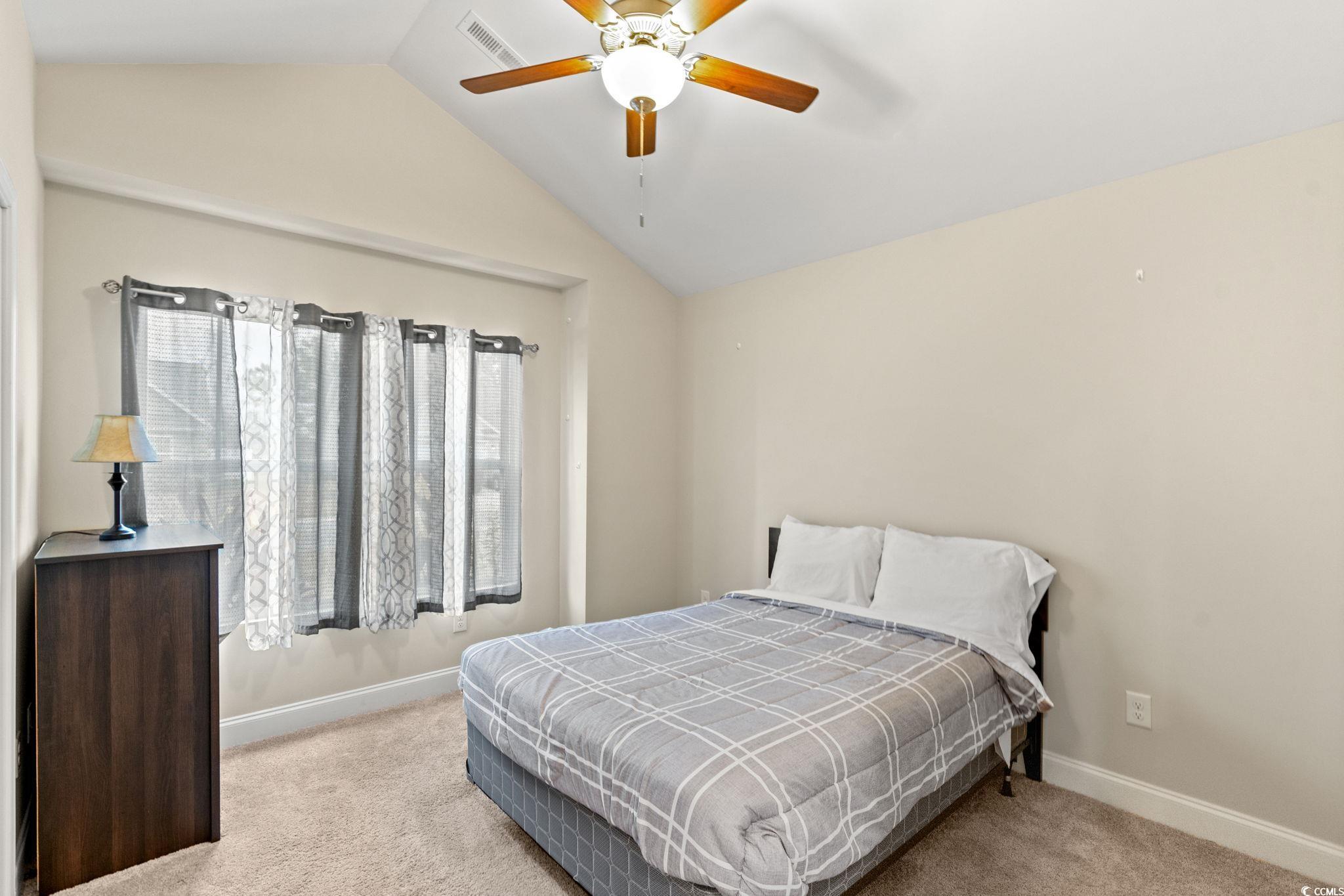 1209 Wehler Court Conway, SC 29526 - Photo 17 of 32 Bedroom with lofted ceiling, light colored carpet, and a ceiling fan