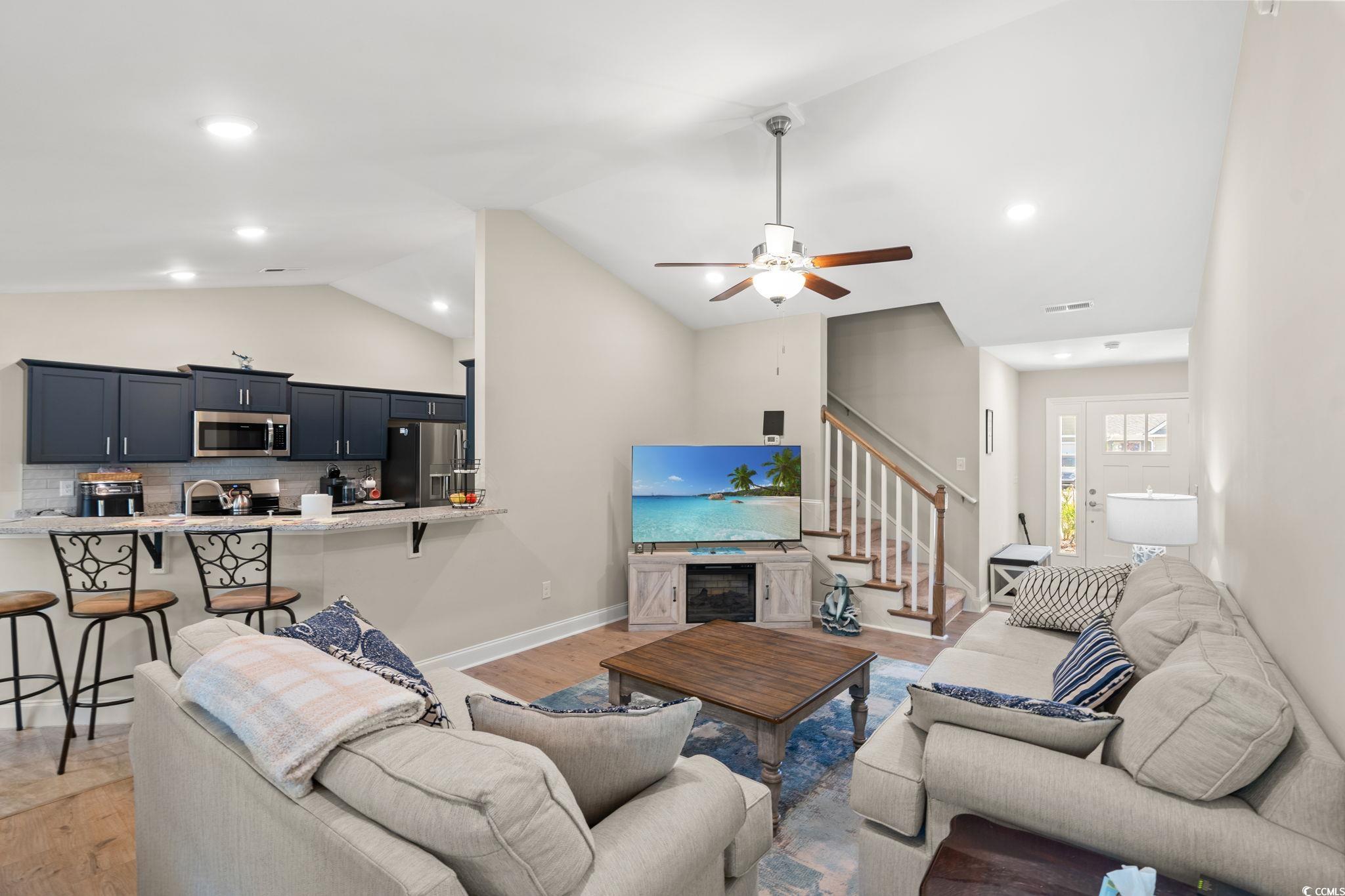 1209 Wehler Court Conway, SC 29526 - Photo 5 of 32 Living room featuring lofted ceiling, stairway, recessed lighting, light wood-type flooring, and a ceiling fan