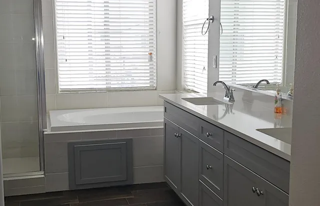 a bathroom with a sink and a window