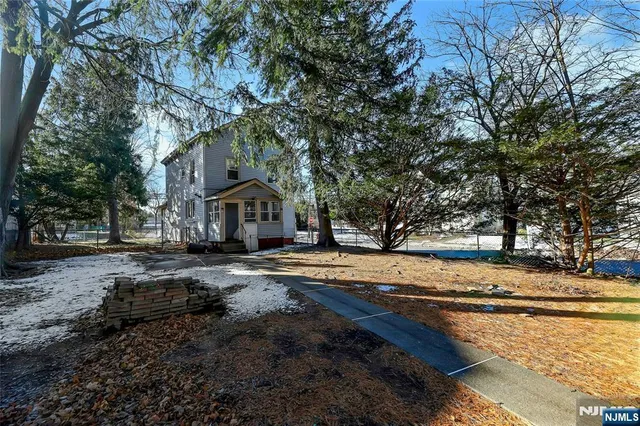 a view of a house with yard and covered with snow