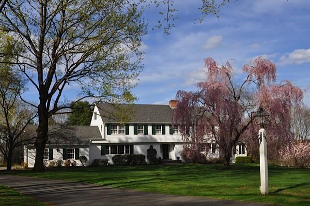 282 Chestnut Hill Road Wilton, CT 06897 - Photo 1 of 1 a front view of house with yard and green space