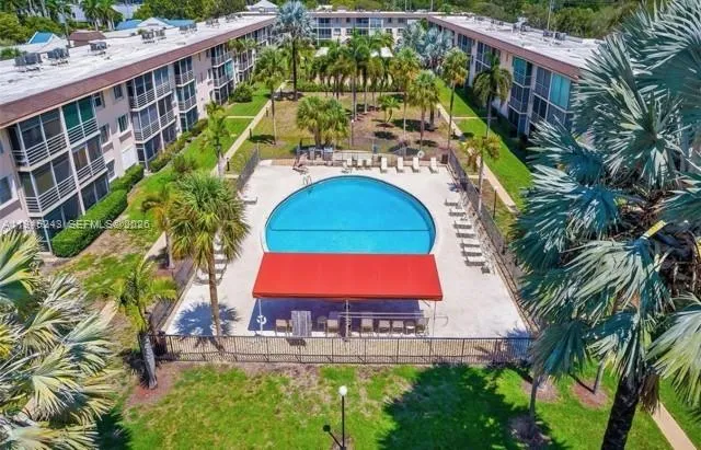 a view of swimming pool with sitting area